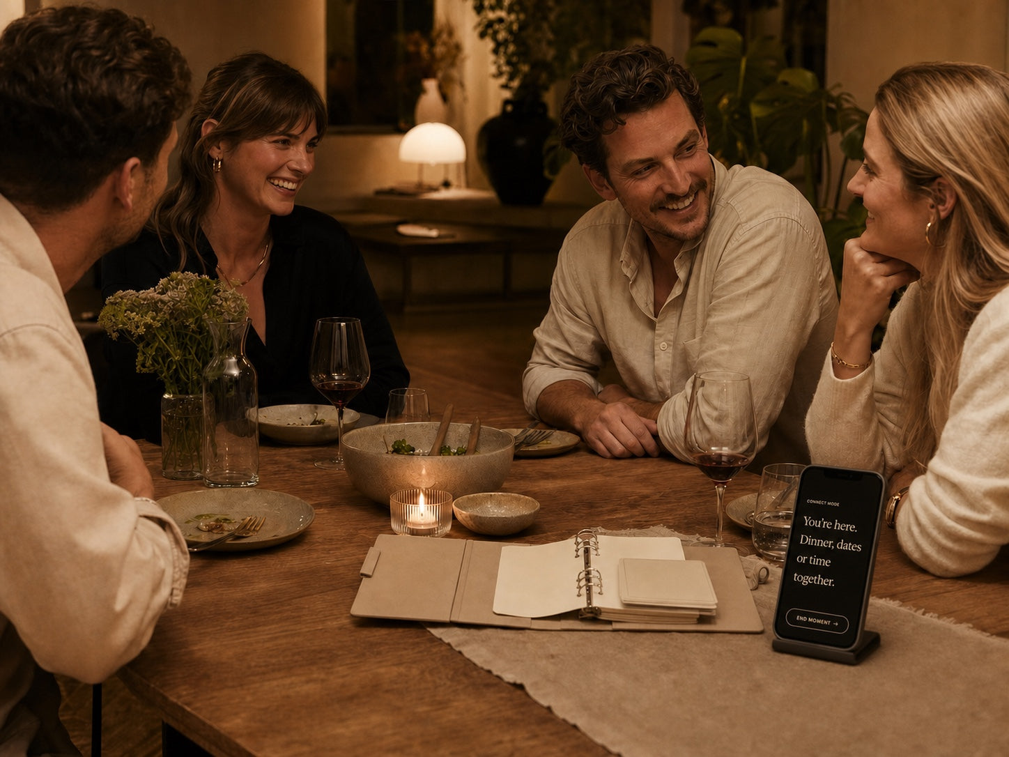 Friends sharing a candlelit dinner around an Offline Era Binder, with the Offline Era app in Connect mode